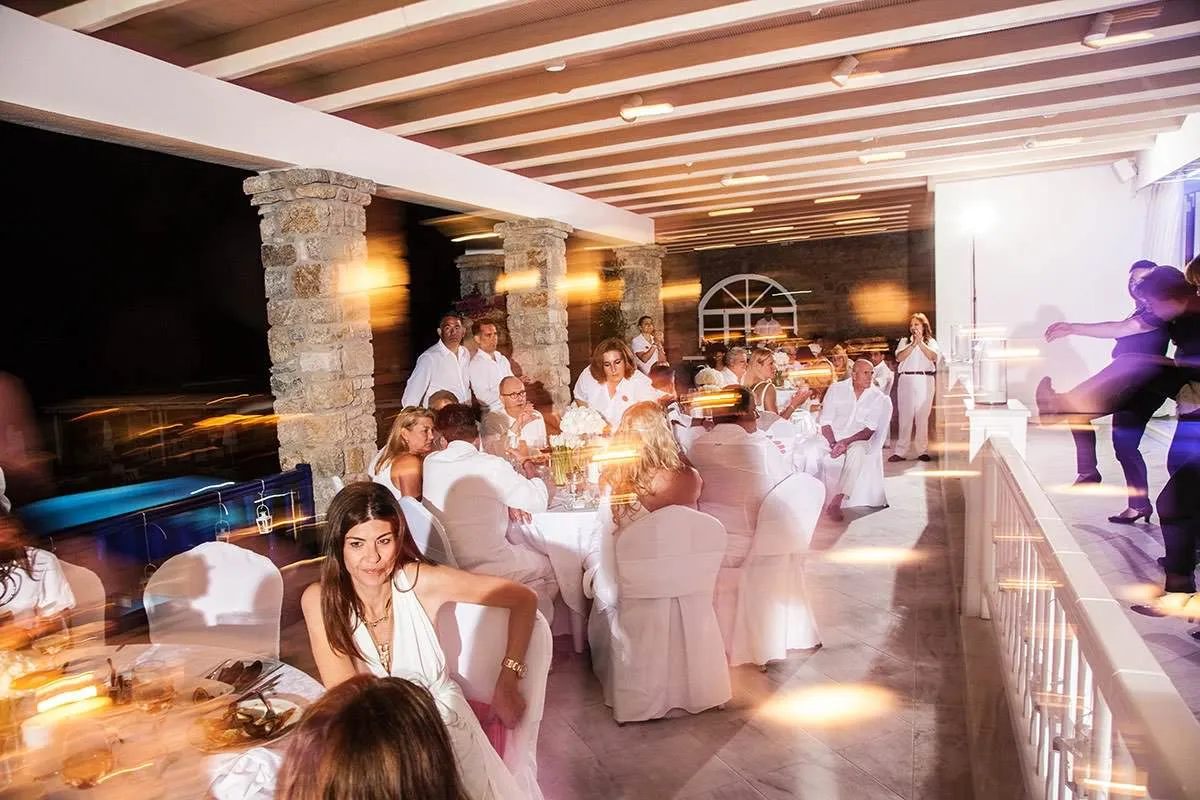 Sunlit romantic wedding photography on a Cycladic terrace, in Mykonos, Greece