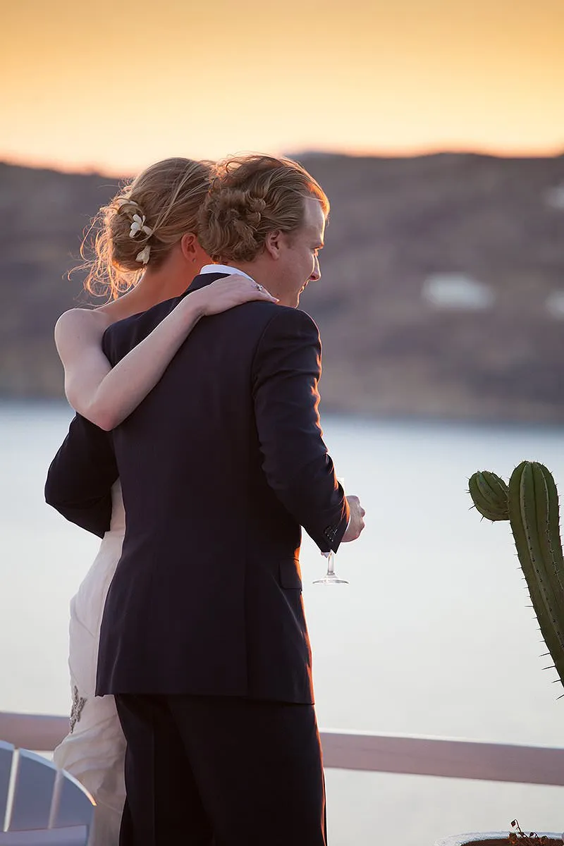 Sunlit rooftop wedding photography on a Cycladic terrace, in Mykonos, Greece