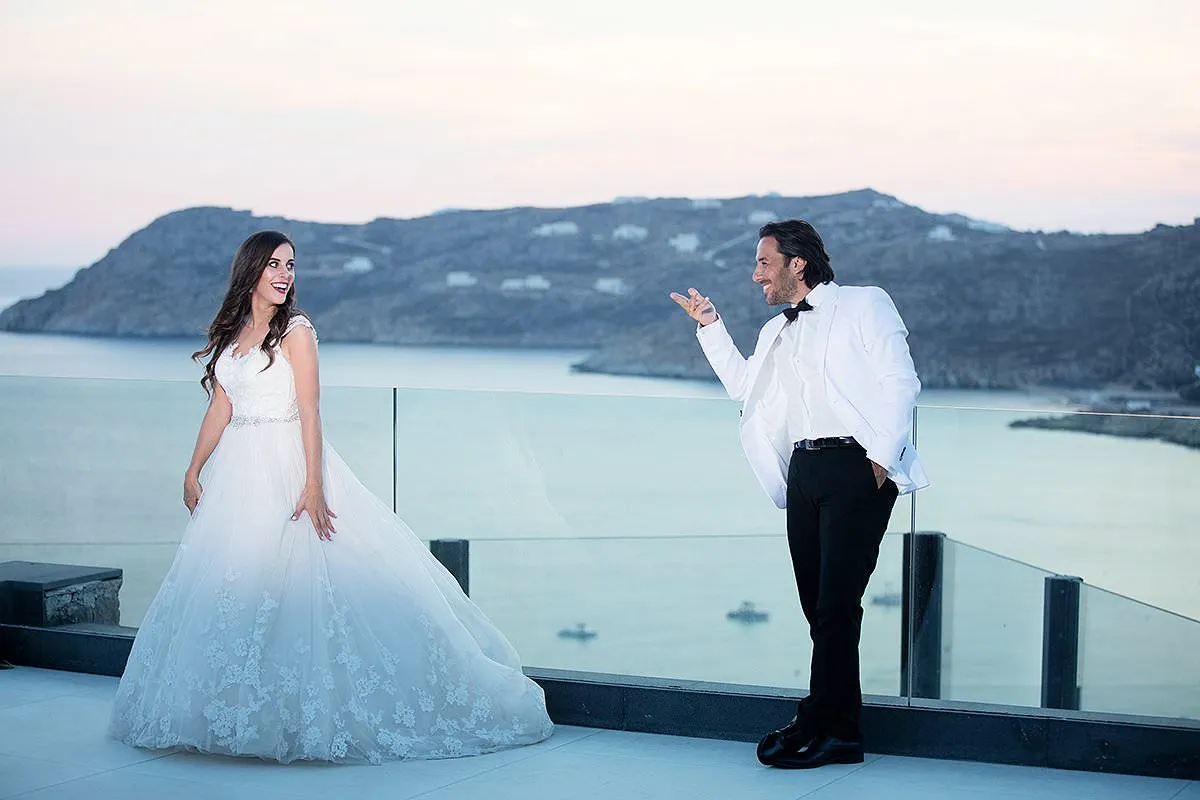 Sunlit sunset wedding photography by the Aegean sea, in Mykonos, Greece
