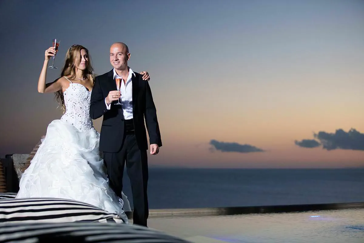 Sunlit sunset wedding photography on a sandy beach, in Mykonos, Greece