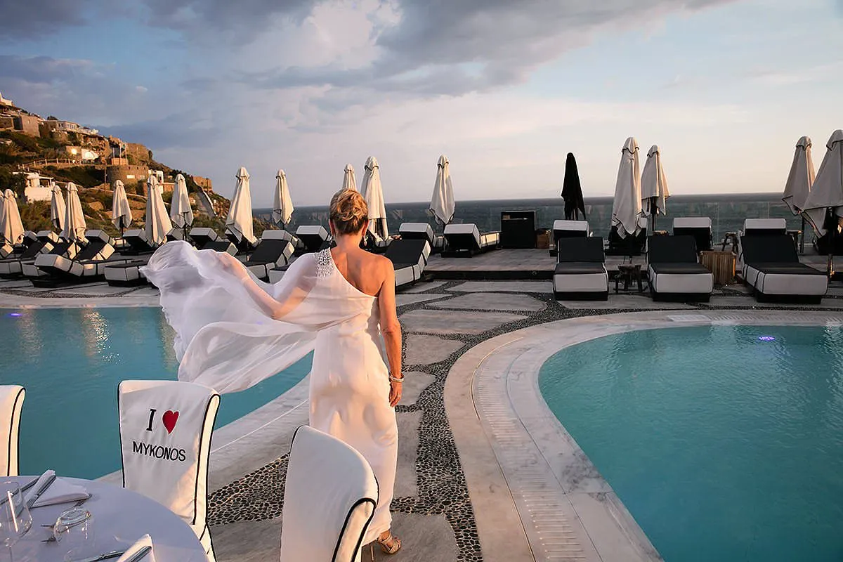 Sunlit white decor wedding photography on a Cycladic terrace, in Mykonos, Greece